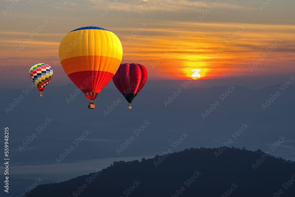 Fototapeta premium Sunrise balloons, Beautiful colorful hot air balloons flying over mountain at view point Sunset of travel place, Doi Ang Khang, Chiang mai in Thailand.