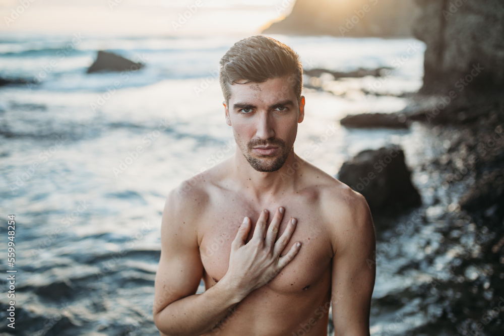 portrait of man on the beach looking at camera portrait of man on the beach looking at camera
