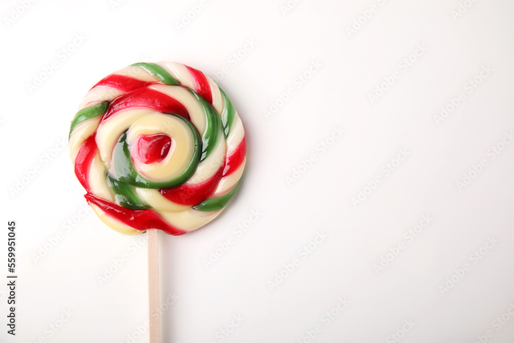 Colorful lollipop on white background, top view. Space for text Colorful lollipop on white background, top view. Space for text