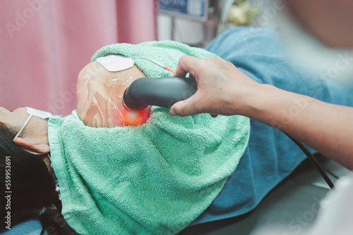 Therapy health and medicine concept, Physiotherapy technique, ultrasound machine, shoulder muscle and nerve pain, physiotherapist using ultrasound head for treatment on shoulder pain.