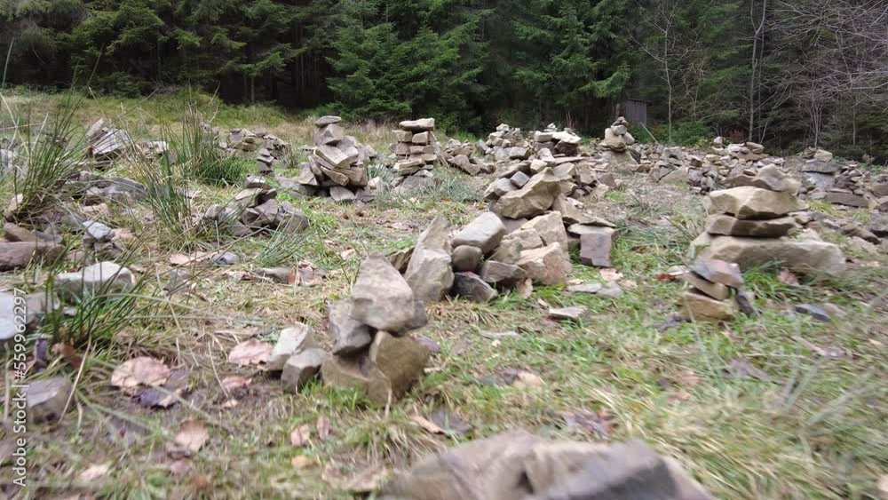 A forest path in the mountains of Ukraine. High mountain lake Synevyr. Stone glade, stones for meditation. Stone graves. A forest path in the mountains of Ukraine. High mountain lake Synevyr. Stone glade, stones for meditation. Stone graves.