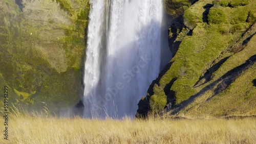 Skogafoss Famous Waterfall in Iceland, Autumn Season on Skoga River. Big Water Stream From Mountain. Popular tourist attraction, Go Everywhere. Travel Europe. Shot in 8K Resolution 4320p photo