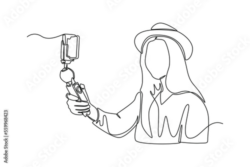 Single one line drawing young woman record live video on modern smartphone gadget. Vlogging concept. Continuous line draw design graphic vector illustration.