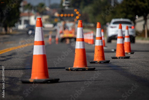 Fotótapéta Traffic cones on road with electronic arrow pointing to the right to divert traf