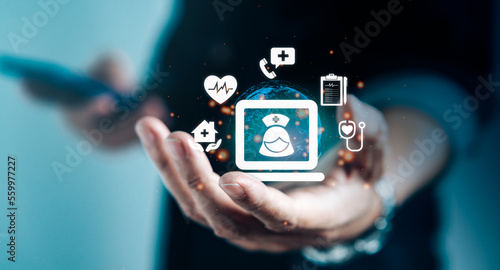 Businessman hand holding virtual medical health care icons on smartphone application