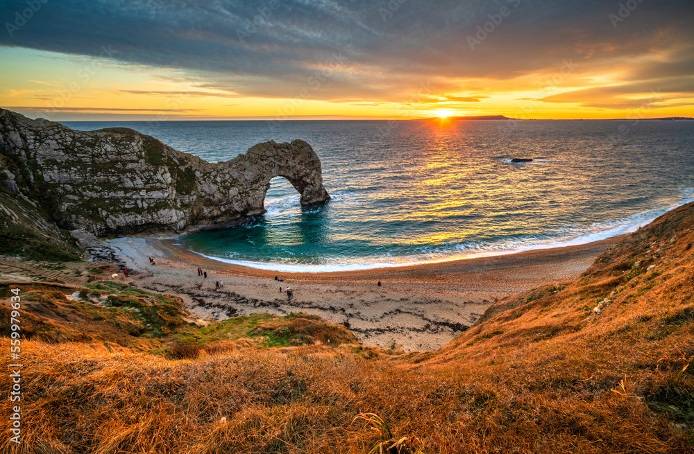 Fototapeta premium Durdle Door at sunset in Dorset, Jurassic Coast of England, UK