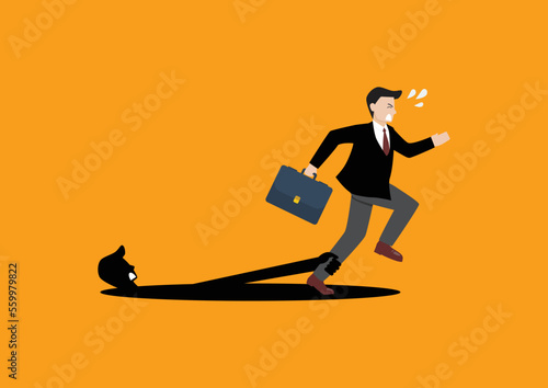 Shadow hand pulling a businessman