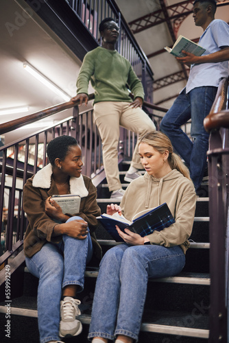 College student group  stairs and reading for study  research and discussion for exam  test or education. Students team  diversity and books for success  goals and focus at university with teamwork