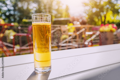 Freshly brewed malt crafted kolsch beer in outdoor bar or german biergarten. Leisure drinks and beverage concept photo
