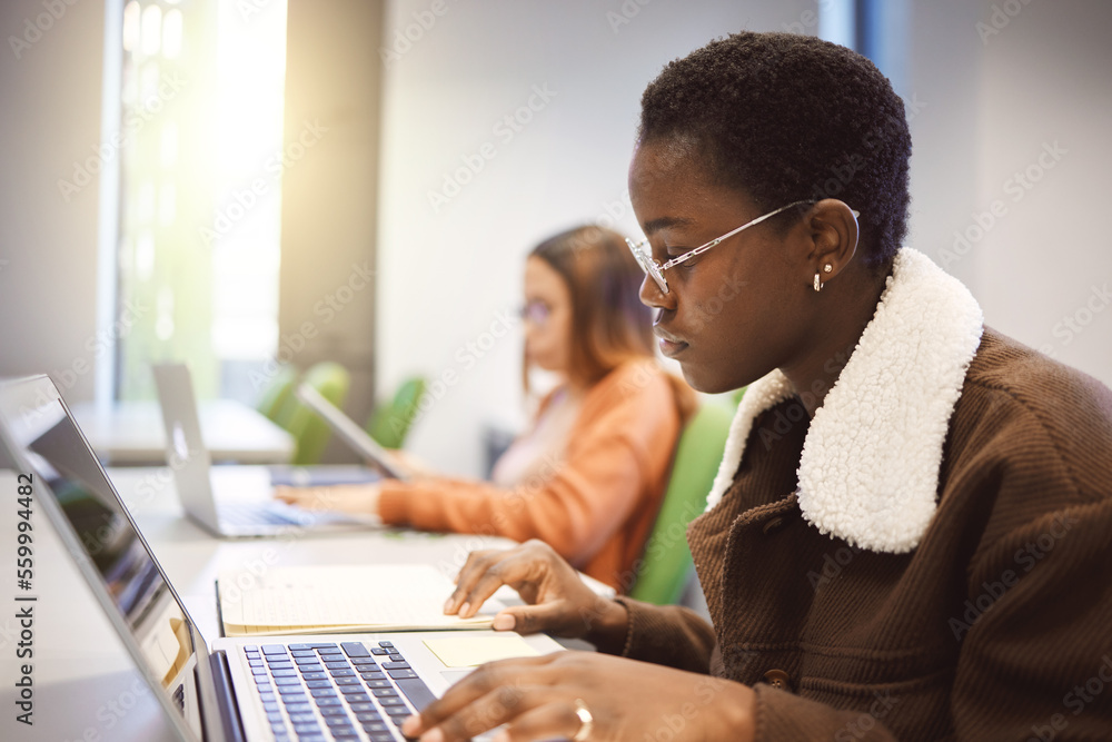 Education, black woman and laptop for studying, knowledge and learning in classroom. African American female, student and academic with online research, study notes or prepare for exam, test or focus Education, black woman and laptop for studying, knowledge and learning in classroom. African American female, student and academic with online research, study notes or prepare for exam, test or focus