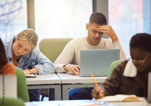 Laptop, stress and man studying, headache and education for knowledge, test and depression. Mental health, male student and academic with computer glitch, online reading and burnout with study notes