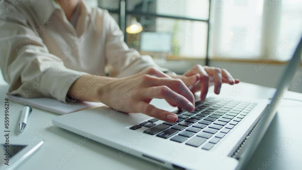 Close up shot of unrecognizable businesswoman working on laptop at office desk Close up shot of unrecognizable businesswoman working on laptop at office desk