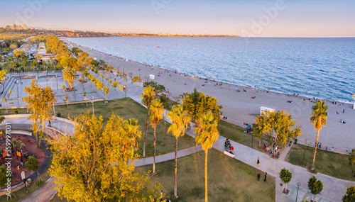 Aerial view of a beach park with vacationers in Antalya, Turkiye. Mediterranean sea coast and riviera.