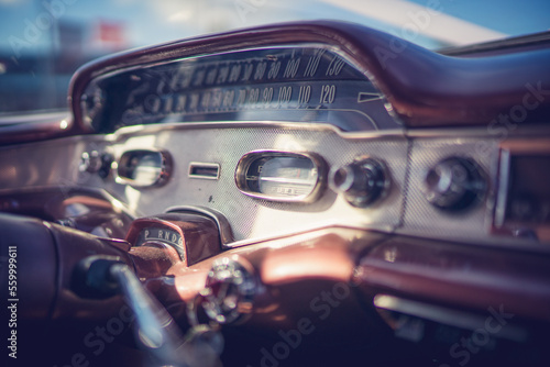 Close up of 1955 Chevrolet interior dashboard with radio knobs and dials.  © James