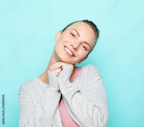 People, happiness and facial expressions concept. Pretty young woman with cute smile.