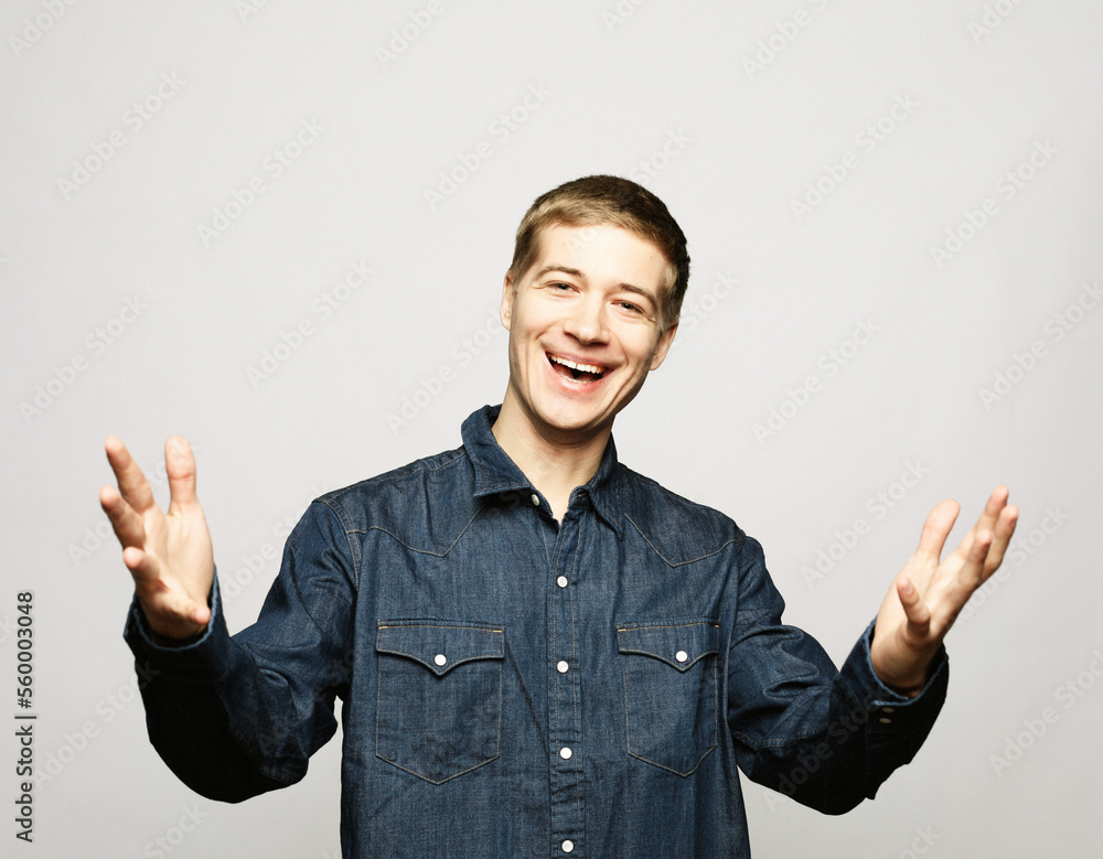 Successful emotional young caucasian male creaming Yes and raising clenched fists in the air Successful emotional young caucasian male creaming Yes and raising clenched fists in the air