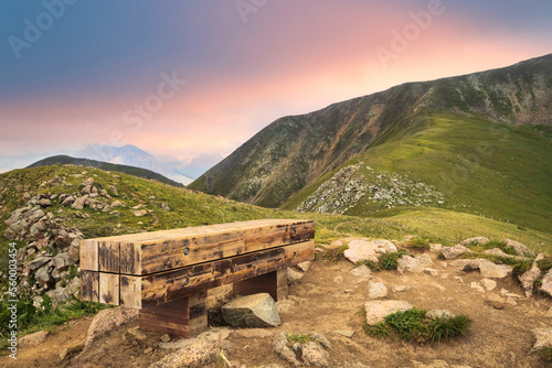 A bench for a halt on Mount Furmanov in the Almaty mountains. View towards Panorama Peak.