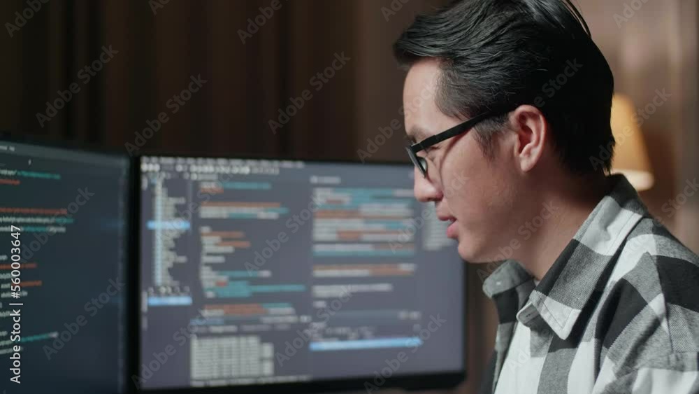 Close Up Of Asian Male Programmer Smiling To Camera While Creating Software Engineer Developing App, Program, Video Game On Desktop Computer At Home. Terminal With Coding Language
Close Up Of Asian Male Programmer Smiling To Camera While Creating Software Engineer Developing App, Program, Video Game On Desktop Computer At Home. Terminal With Coding Language