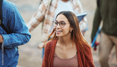 Happy woman, students and walking on university, college campus or school in morning class commute, study break or rest. Smile, people or bonding friends and education learning or scholarship goals