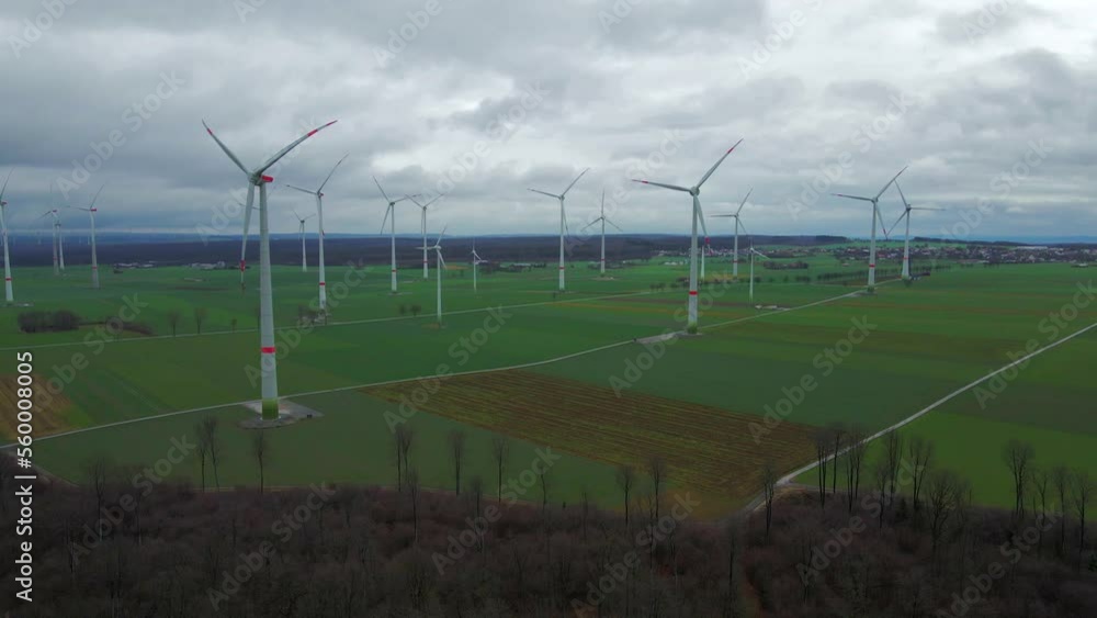 Cloudy Sky and Sustainable Energy: Wind Turbines Generating Power on a Beautiful Field in Bad Wünnenberg, Paderborn,North Rhine-Westphalia, Germany Cloudy Sky and Sustainable Energy: Wind Turbines Generating Power on a Beautiful Field in Bad Wünnenberg, Paderborn,North Rhine-Westphalia, Germany