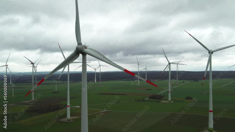 Eco-Friendly Energy in Germany: High Angle View of Wind Turbines Surrounded by Farmland close to Bad Wünnenberg, Paderborn in North Rhine-Westphalia Eco-Friendly Energy in Germany: High Angle View of Wind Turbines Surrounded by Farmland close to Bad Wünnenberg, Paderborn in North Rhine-Westphalia