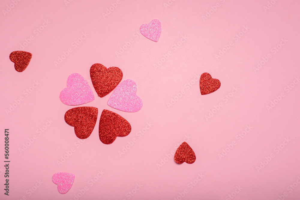 Multiple glitter hearts on a pink background. Love concept. Multiple glitter hearts on a pink background. Love concept.
