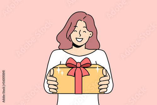 Smiling young woman hold wrapped beautiful present in hands congratulate with Christmas. Happy girl give gift greeting with New Year holidays. Vector illustration. 