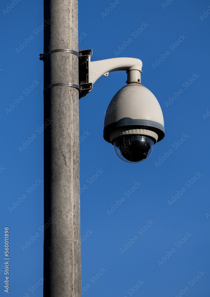 CCTV security dome camera on pole outdoor at blue sky CCTV security dome camera on pole outdoor at blue sky
