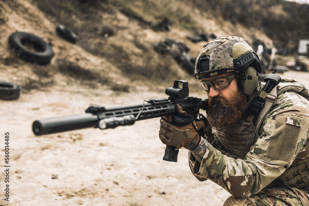 Fototapeta premium Sniper with rifle on a position