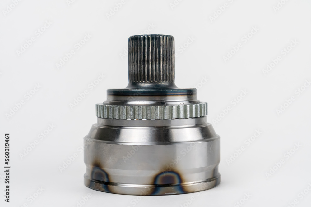 Close-up of a constant velocity joint on a white background. Universal spherical joint with constant speed new shiny. Concept of repair, car service, spare parts store Close-up of a constant velocity joint on a white background. Universal spherical joint with constant speed new shiny. Concept of repair, car service, spare parts store