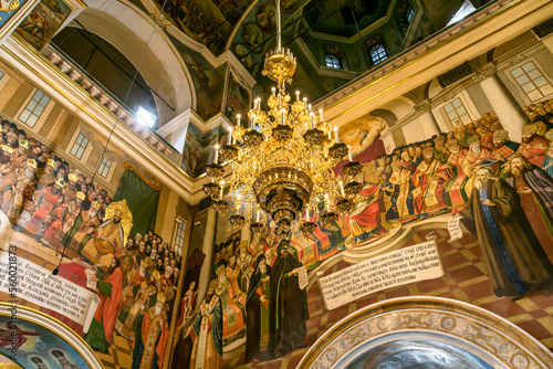 Gorgeously decorated altar and frescoes on walls in the interior of Holy Dormition Cathedral in Pechersk Lavra, Kyiv photo