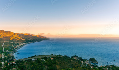 travel landscape scenic picture of beautiful highland mountain town in sunrise or sunset with sea shore on background