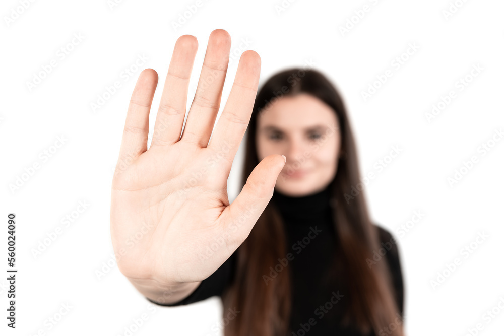 Stop! Young beautiful girl over isolated white background making stop gesture with her hand Stop! Young beautiful girl over isolated white background making stop gesture with her hand
