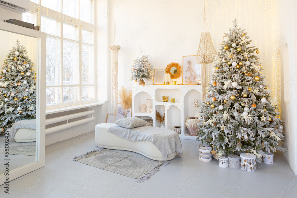 room interior with Christmas tree decorated with golden balls toys on blurred, sparkling and fabulous fairy tale background with beautiful bokeh