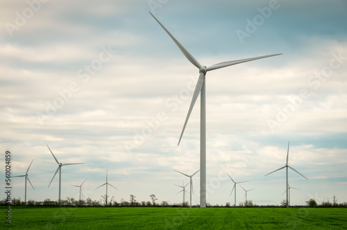 Wind turbines generating electricity with blue sky - energy conservation concept