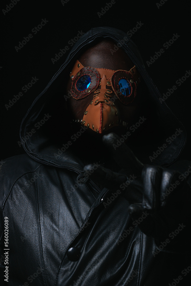 Plague doctor with crow-like mask isolated on black background Creepy halloween historical terrible costume concept Epidemic covid smallpox monkeypox Plague doctor with crow-like mask isolated on black background Creepy halloween historical terrible costume concept Epidemic covid smallpox monkeypox