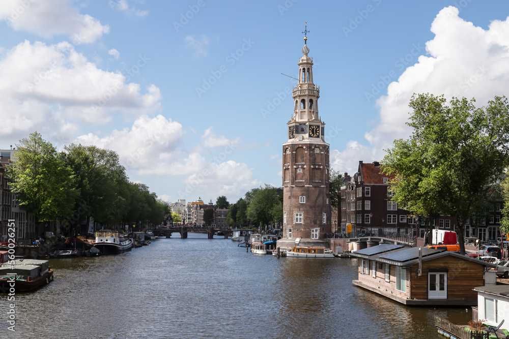 Medieval Montelbaanstoren along the canal in the center of Amsterdam.