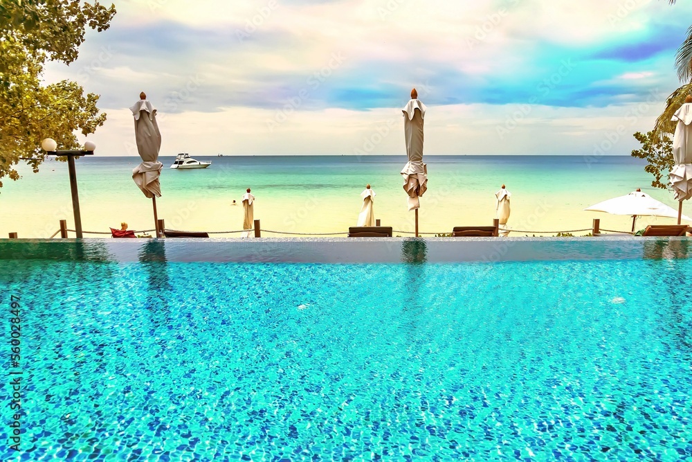 Rayong, Thailand - October, 15, 2022 : Swimming pool of Ao Prao Resort at the Koh Samet island, Rayong, Thailand