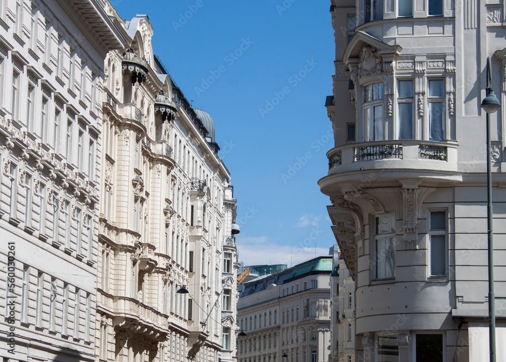 Facade of historical buildings in the old town of Vienna, Austria, Central Europe. Ornaments and patterns of white houses, architectural background. Exterior view of luxury and elegant neighborhood. Facade of historical buildings in the old town of Vienna, Austria, Central Europe. Ornaments and patterns of white houses, architectural background. Exterior view of luxury and elegant neighborhood.