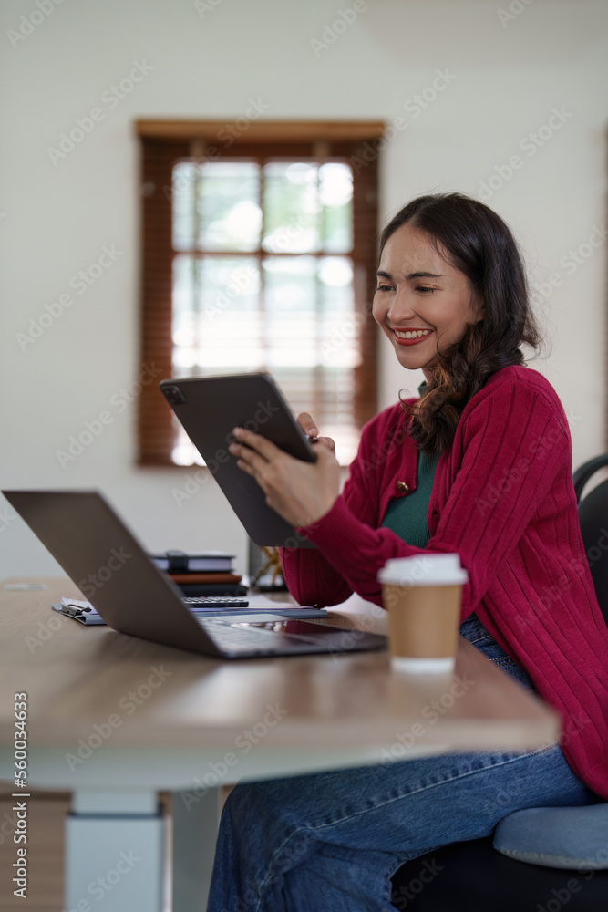 Asian Business woman working at home office and analyze financial report document. Accounting and Finance concept Asian Business woman working at home office and analyze financial report document. Accounting and Finance concept