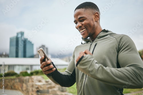 Fototapeta Naklejka Na Ścianę i Meble -  Fitness, winner or black man on phone with success or winning a training, exercise or workout competition online. City, excited or healthy sports athlete happy with sponsorship deal, goals or mission