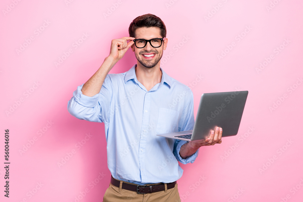 Photo of positive smart man recruiter wear spectacles hold macbook use modern device write news post isolated on pink color background