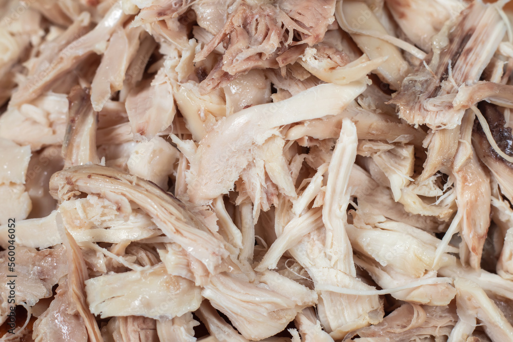 Pieces of boiled chicken breast background close up. Pieces of boiled chicken breast background close up.
