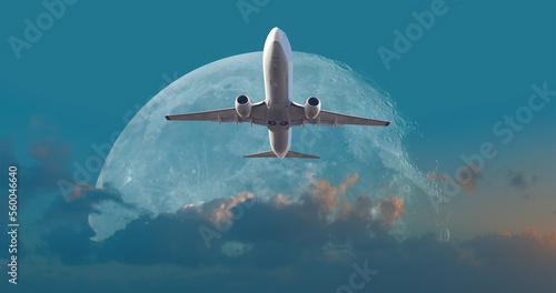 White passenger airplane in the sky  with full moon  - Travel by air transport 