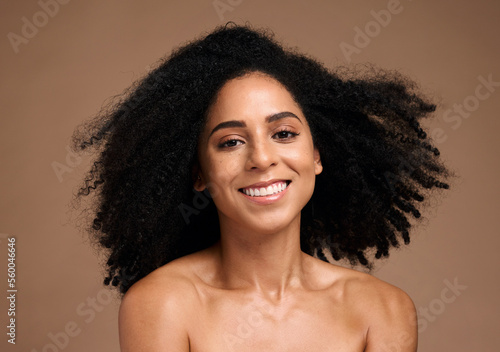 African woman, smile and portrait for skincare beauty wellness, happiness and facial glow or natural afro hair care in brown background studio. Black model, smile and luxury cosmetics dermatology