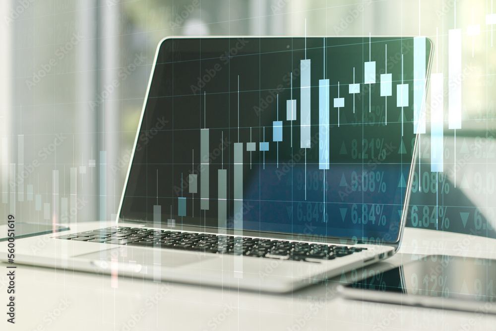 Abstract creative financial graph on modern laptop background, financial and trading concept. Multiexposure Abstract creative financial graph on modern laptop background, financial and trading concept. Multiexposure