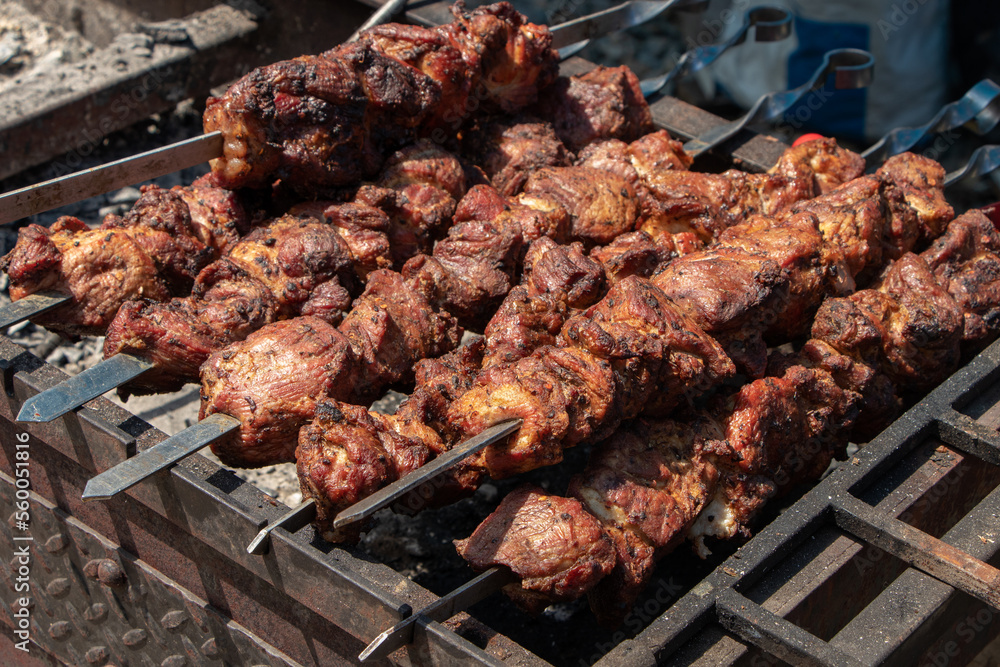 Marinated shashlik preparing on a barbecue grill over charcoal. Shashlik or Shish kebab popular in Eastern Europe. Shashlyk skewered meat was originally made of lamb. Roast Beef Kebabs On BBQ Grill. Marinated shashlik preparing on a barbecue grill over charcoal. Shashlik or Shish kebab popular in Eastern Europe. Shashlyk skewered meat was originally made of lamb. Roast Beef Kebabs On BBQ Grill.