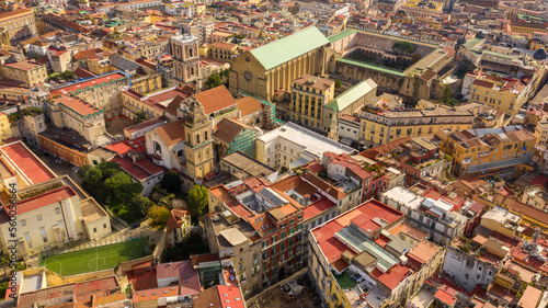 Aerial view of the Basilica of Santa Chiara, a religious complex in Naples, Italy, which includes a church, a monastery, tombs and an archaeological museum. The building overlooks Via Spaccanapoli.