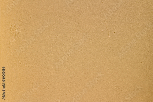 Painted wall background texture with colored drops. Earth tone color, Beige backgrounds. Temple wall textured