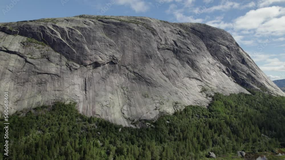 Close up of Haegefjell historic mountain range cliff surrounded by lush forest Close up of Haegefjell historic mountain range cliff surrounded by lush forest